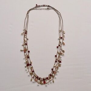 Set of 3 18” gold tone necklaces with dark red, orange, white & gold beads